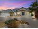 Charming single-story home featuring desert landscaping and an inviting curb appeal on a sunny day at 1251 Cavalry St, Pahrump, NV 89048