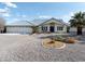 Well-maintained home featuring desert landscaping, a three-car garage, and charming curb appeal at 1251 Cavalry St, Pahrump, NV 89048