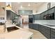 Spacious kitchen with modern gray cabinets, stainless steel appliances, and large island at 1251 Cavalry St, Pahrump, NV 89048
