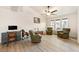 Bright living room featuring hardwood style floors, natural light, and versatile seating options at 1251 Cavalry St, Pahrump, NV 89048