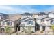 View of the tops of grey homes with tile roofs in gated community. Solar panels are visible at 1323 Cerulean Ave, Henderson, NV 89002