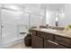 Bathroom featuring a glass-enclosed shower and granite countertops at 1323 Cerulean Ave, Henderson, NV 89002