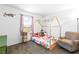 Charming bedroom with a decorative bed frame, pink accents, and natural light at 1323 Cerulean Ave, Henderson, NV 89002