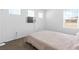 Bright bedroom with neutral walls, plush carpet, and natural light from windows at 1323 Cerulean Ave, Henderson, NV 89002