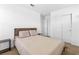 This cozy bedroom features neutral decor, plush carpet, and modern closet doors at 1323 Cerulean Ave, Henderson, NV 89002