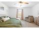 Relaxing bedroom with a large bed, seating area, and lots of natural light at 1323 Cerulean Ave, Henderson, NV 89002