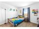 Bright bedroom with colorful accents, whimsical décor, and comfortable bed at 1323 Cerulean Ave, Henderson, NV 89002