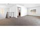 Bonus room landing featuring new carpeting, white walls, and ample natural light at 1323 Cerulean Ave, Henderson, NV 89002