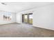 Bright, spacious bonus room with new carpet and sliding glass doors to the outdoor patio at 1323 Cerulean Ave, Henderson, NV 89002