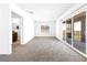 Bonus room with sliding glass doors to the patio and a bathroom visible in background at 1323 Cerulean Ave, Henderson, NV 89002