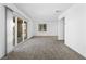 Bright bonus room featuring new carpet, white walls, and access to the outdoor patio at 1323 Cerulean Ave, Henderson, NV 89002