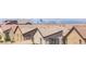 View of the city skyline from behind the roof lines of houses in the community at 1323 Cerulean Ave, Henderson, NV 89002