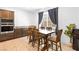 Dining area features wood table, six chairs, recessed lighting and large window at 1323 Cerulean Ave, Henderson, NV 89002