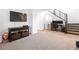 Spacious living area with stairs, media console, and contemporary design at 1323 Cerulean Ave, Henderson, NV 89002