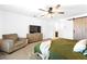 Comfortable main bedroom featuring a ceiling fan and an accent sliding barn door at 1323 Cerulean Ave, Henderson, NV 89002
