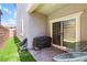 Cozy covered patio with pavers, artificial grass, and comfortable outdoor seating at 1323 Cerulean Ave, Henderson, NV 89002