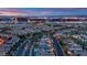 An aerial view of a community with the city skyline in the distance at 1972 Alcova Ridge Dr, Las Vegas, NV 89135