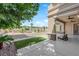 Lush backyard with a pool, outdoor seating, and a covered patio for relaxing and entertaining at 1972 Alcova Ridge Dr, Las Vegas, NV 89135