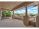Spacious covered balcony framed by stately columns, offering panoramic views of the community and mountains at 1972 Alcova Ridge Dr, Las Vegas, NV 89135