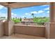 Scenic balcony with decorative iron railing, offering views of the lush neighborhood and blue skies at 1972 Alcova Ridge Dr, Las Vegas, NV 89135