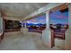 Large balcony with stone columns overlooking the neighborhood at 1972 Alcova Ridge Dr, Las Vegas, NV 89135
