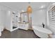Beautiful bathroom features a soaking tub, shower, and modern fixtures with natural lighting at 1972 Alcova Ridge Dr, Las Vegas, NV 89135