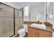 Modern bathroom showcasing a glass-enclosed shower and a stylish vanity with a square sink at 1972 Alcova Ridge Dr, Las Vegas, NV 89135