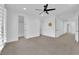 Bright and airy bedroom with a ceiling fan, neutral palette, and multiple doorways for easy access at 1972 Alcova Ridge Dr, Las Vegas, NV 89135