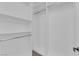 Walk-in closet with ample shelving and hanging space, designed for optimal storage and organization at 1972 Alcova Ridge Dr, Las Vegas, NV 89135