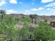 Residential view of a Las Vegas community with lush greenery, and the mountains in the background at 1972 Alcova Ridge Dr, Las Vegas, NV 89135