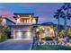 Stunning home with palm trees and lush green lawn at 1972 Alcova Ridge Dr, Las Vegas, NV 89135