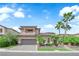 Charming two-story home featuring a well-manicured front yard and a two car garage at 1972 Alcova Ridge Dr, Las Vegas, NV 89135