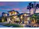 Beautifully landscaped home exterior with palm trees and stone accents at 1972 Alcova Ridge Dr, Las Vegas, NV 89135