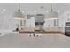 Modern kitchen with large island, stainless steel appliances, white cabinets, and beautiful countertops at 1972 Alcova Ridge Dr, Las Vegas, NV 89135