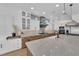Spacious kitchen featuring an oversized island with marble countertops and pendant lighting at 1972 Alcova Ridge Dr, Las Vegas, NV 89135