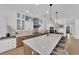 Bright modern kitchen features a large island, designer lighting, and premium stainless appliances at 1972 Alcova Ridge Dr, Las Vegas, NV 89135