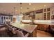 Spacious kitchen features a large island, modern appliances, and ample seating at 1972 Alcova Ridge Dr, Las Vegas, NV 89135