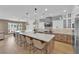 Open kitchen featuring a large island with seating, pendant lighting, and modern appliances at 1972 Alcova Ridge Dr, Las Vegas, NV 89135