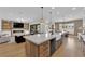 Spacious open concept with sleek kitchen island, fireplace, and seamless indoor-outdoor living at 1972 Alcova Ridge Dr, Las Vegas, NV 89135