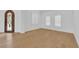 Spacious room featuring an arched door and windows with shutter blinds at 1972 Alcova Ridge Dr, Las Vegas, NV 89135
