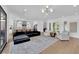 Open concept living area with views of the kitchen, fireplace and backyard at 1972 Alcova Ridge Dr, Las Vegas, NV 89135