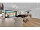 Spacious open concept living area featuring a modern fireplace and pool views at 1972 Alcova Ridge Dr, Las Vegas, NV 89135