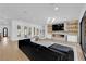 Spacious living room with a modern fireplace and sliding glass doors to the yard at 1972 Alcova Ridge Dr, Las Vegas, NV 89135