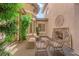 Inviting courtyard with fireplace, cozy seating, and lush greenery at 1972 Alcova Ridge Dr, Las Vegas, NV 89135