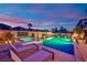 Beautiful pool and lounge area with comfortable seating, perfect for relaxation and entertaining guests at 1972 Alcova Ridge Dr, Las Vegas, NV 89135