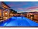 Beautiful backyard pool and landscaping, with a stone patio and privacy wall at 1972 Alcova Ridge Dr, Las Vegas, NV 89135