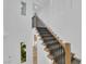 Bright and modern staircase with carpet runner and wooden banister at 1972 Alcova Ridge Dr, Las Vegas, NV 89135