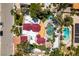Aerial view showcasing the home's unique roof, lush landscaping, and backyard pool at 2101 Diamond Bar Dr, Las Vegas, NV 89117
