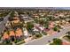 Wide aerial shot of the home, the neighborhood and distant mountains at 2101 Diamond Bar Dr, Las Vegas, NV 89117