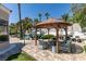 Backyard with a comfortable outdoor lounge, a BBQ area, and a tranquil waterfall feature at 2101 Diamond Bar Dr, Las Vegas, NV 89117